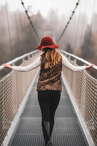 Girl Walking On Switzerland Mountains Bridges 4k (640x960) Resolution Wallpaper