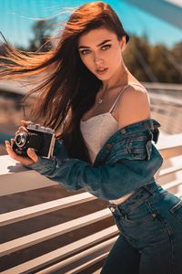 Girl With Camera On Bridge (1440x2560) Resolution Wallpaper