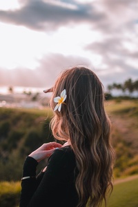 Girl With Flower In Her Hair (640x1136) Resolution Wallpaper