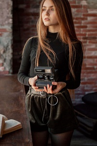 Girl With Retro Camera In Hand 4k (360x640) Resolution Wallpaper