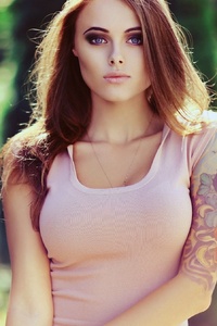 Girl With Tattoo On Arm