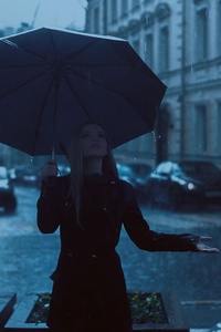 Girl With Umbrella Enjoying Rain