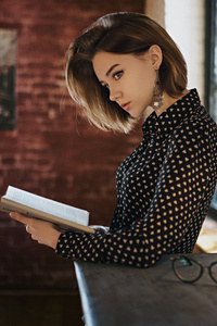 Gorgeous Girl With Book Looking Away (320x480) Resolution Wallpaper
