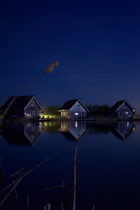 Houses At Lake Water Starry Night 5k (320x480) Resolution Wallpaper
