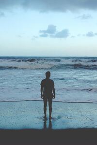 Man Standing At Ocean Shore (720x1280) Resolution Wallpaper
