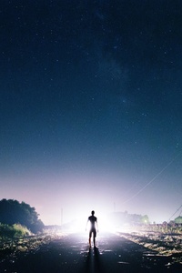 Man Standing In Front Of Light (240x320) Resolution Wallpaper