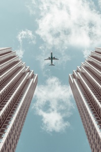 Plane Between Two Buildings 5k