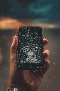 Raindrops On Phone Display In Hand Outdoors 4k (480x800) Resolution Wallpaper