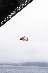 Rescue Helicopter Flying Under Golden Gate Bridge (2160x3840) Resolution Wallpaper