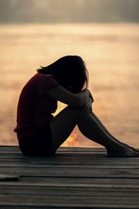 Sad Girl Sitting On Dock Silhouette