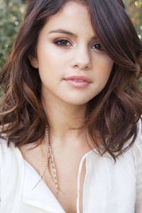 Selena Gomez Closeup Face (240x400) Resolution Wallpaper