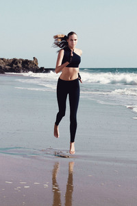 Sports Model Running On Beach