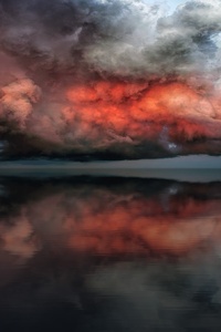 Storm Red Clouds Touching Ocean (1125x2436) Resolution Wallpaper