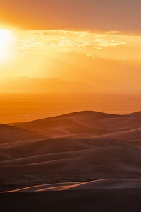 Sun Is Setting Over The Sand Dunes (640x960) Resolution Wallpaper
