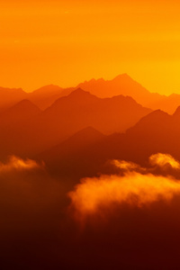 Sun Setting Over A Mountain Range Dark Evening (750x1334) Resolution Wallpaper