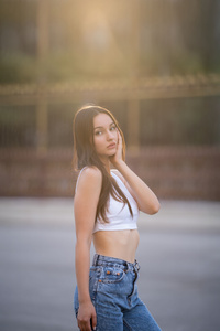 White Top Girl Looking At The Viewer (1080x2400) Resolution Wallpaper