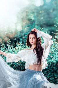 Woman In Flowing Dress With Green Bokeh (640x1136) Resolution Wallpaper