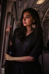 Women Standing In Train Holding Metal Rail While Looking Outside 5k (750x1334) Resolution Wallpaper