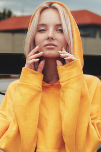 1242x2688 Yellow Hoodie Girl With Nose Ring